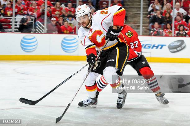 Akim Aliu of the Calgary Flames watches for the puck during the NHL game against the Chicago Blackhawks on April 26, 2013 at the United Center in...