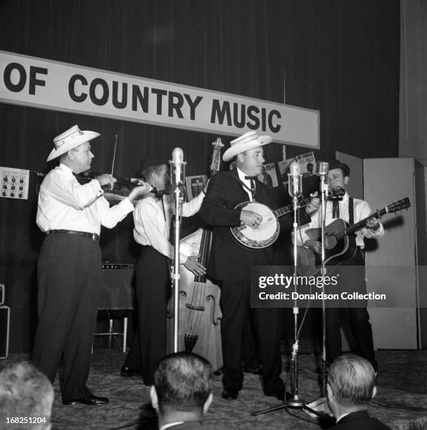 Paul Warren on fiddle, Jake Tullock on bass, Buck Graves on dobro, Earl Scruggs on banjo and Lester Flatt on guitar of the bluegrass group "Flatt And...