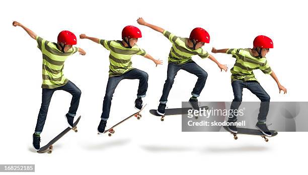 boy skateboarding sobre un fondo blanco - misma persona fotografías e imágenes de stock