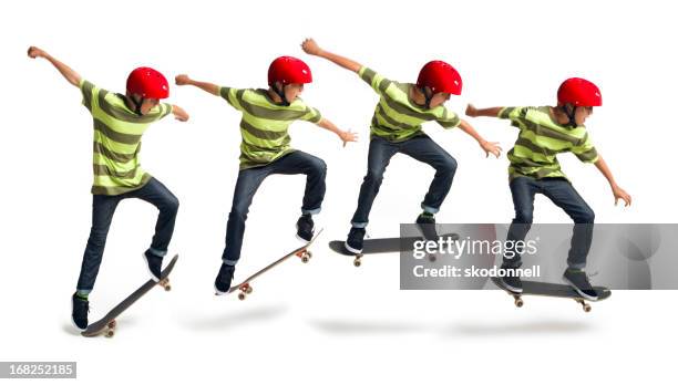 boy skateboarding on a white background - kids side view isolated stockfoto's en -beelden