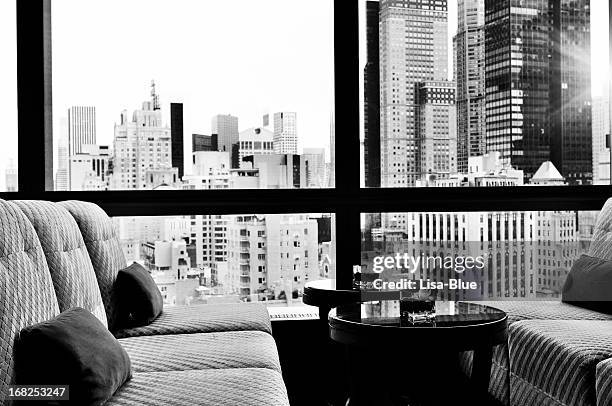 nyc skyline from a window bar lounge, nyc. black and white. - skyline zwart wit stockfoto's en -beelden