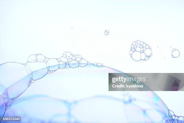 blue tinted image of soap bubbles - shampoo stock pictures, royalty-free photos & images