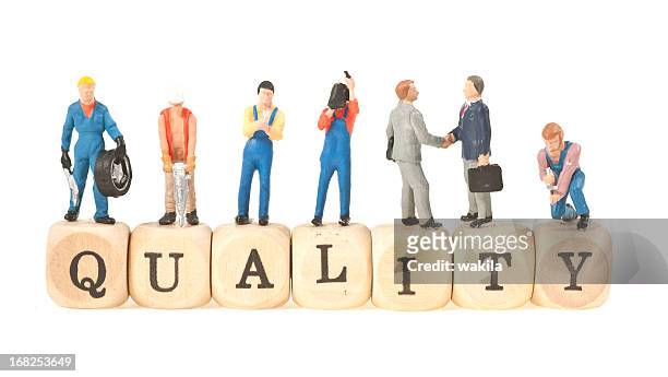 quality word with figurines - 3d human model stock pictures, royalty-free photos & images