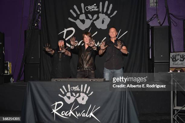 Goo Goo Dolls band members Robby Takac, John Rzeznik and Mike Malinin attend a ceremony inducting The Goo Goo Dolls into the Guitar Center RockWalk...