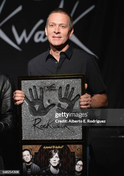 Goo Goo Dolls band member Mike Malinin attends a ceremony inducting The Goo Goo Dolls into the Guitar Center RockWalk at Guitar Center on May 7, 2013...