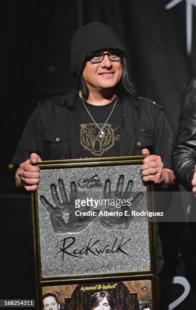Goo Goo Dolls band member Robby Takac attends a ceremony inducting The Goo Goo Dolls into the Guitar Center RockWalk at Guitar Center on May 7, 2013...