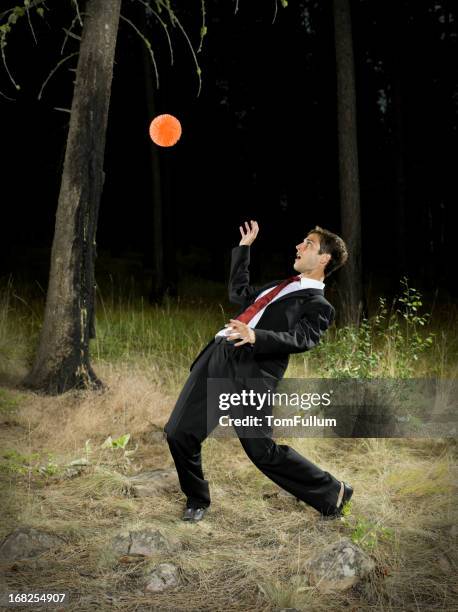 businessman evading ball - wegduiken stockfoto's en -beelden