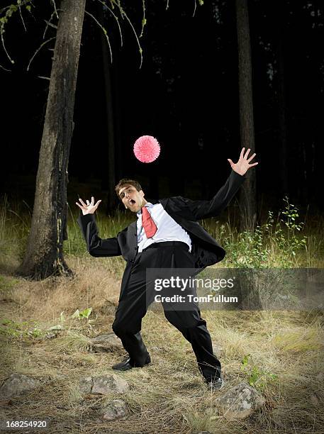 businessman dodging ball - dodging stock pictures, royalty-free photos & images