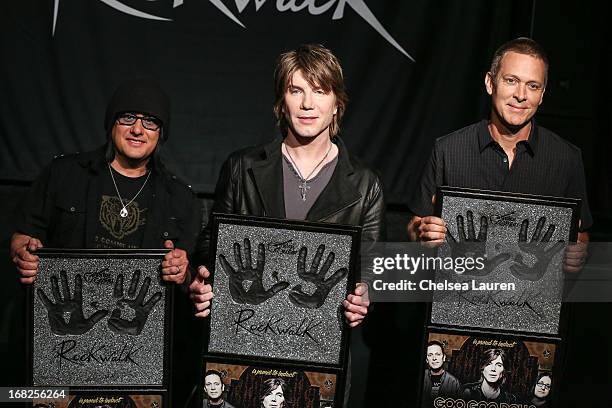 Bassist Robby Takac, vocalist / guitarist John Rzeznik and drummer Mike Malinin of Goo Goo Dolls are inducted into Guitar Center's historic RockWalk...