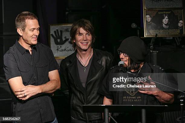Drummer Mike Malinin, vocalist / guitarist John Rzeznik and bassist Robby Takac of Goo Goo Dolls are inducted into Guitar Center's historic RockWalk...