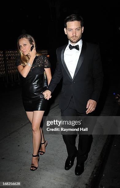 Actor Tobey Maguire and Jennifer Meyer leave the 'PUNK: Chaos To Couture' Costume Institute Gala after party at the Standard Hotel on May 6, 2013 in...