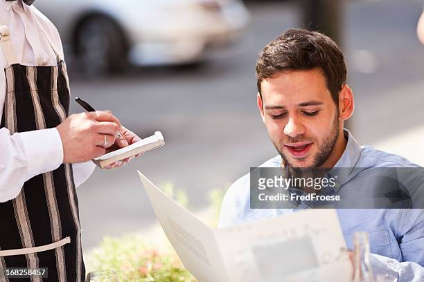 junger mann im restaurant café - demanding stock-fotos und bilder