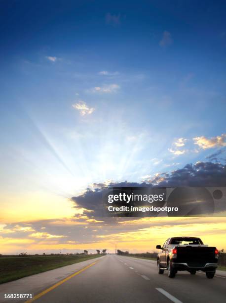 on the road over sunset - pick up truck stock pictures, royalty-free photos & images