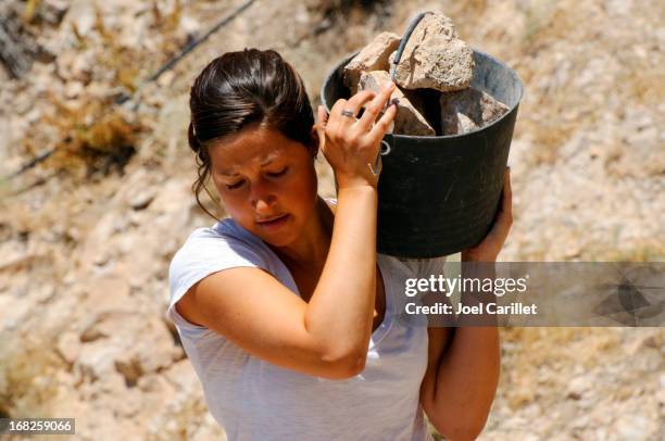 young woman and manual labor - heavy stone stock pictures, royalty-free photos & images
