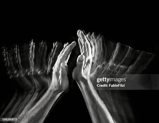 many hands giving a round of applause - hand clapping stock pictures, royalty-free photos & images