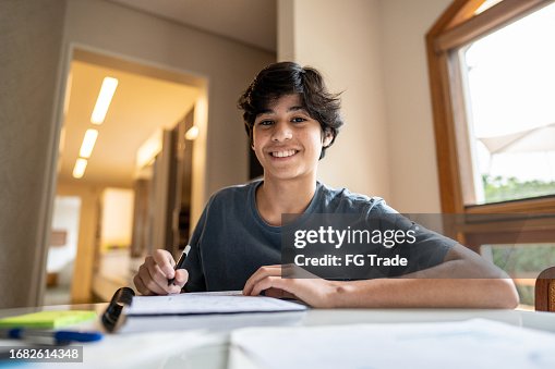 Portrait of a teenager boy studying at home Portrait of a teenager boy studying at home