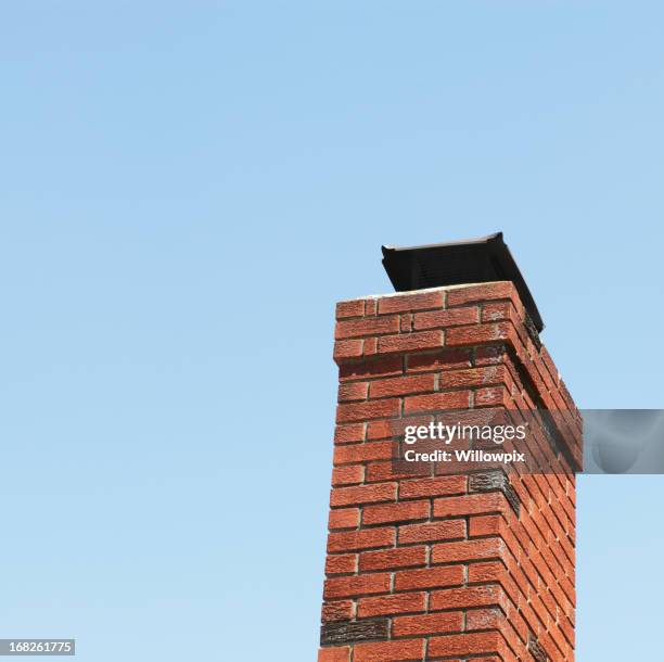 red brick chimney and blue sky - chimney cap stock pictures, royalty-free photos & images
