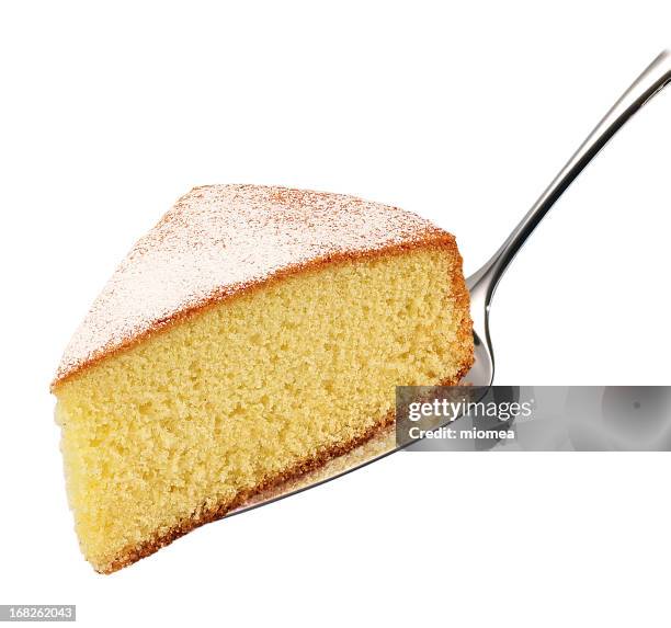 a cake slice on a silver spoon - taartpunt stockfoto's en -beelden