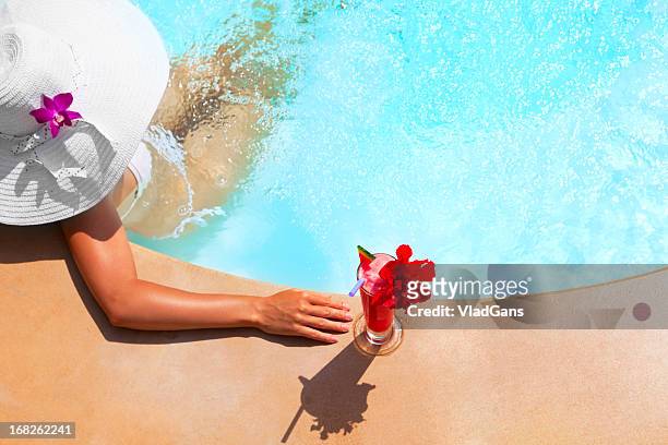 woman relaxing in waterpool - pool refreshment stock pictures, royalty-free photos & images