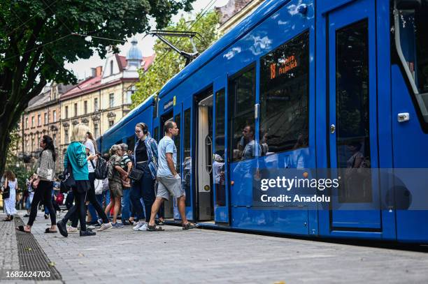 People ride on a tram as the city offers free rides during the European Car Free day in Krakow, Poland on September 22, 2023. On the European Car...