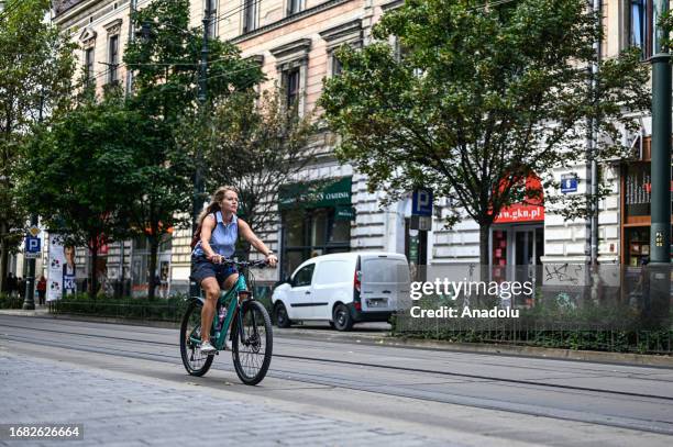 People ride bicycle during the European Car Free day in Krakow, Poland on September 22, 2023. On the European Car free week, everyone traveling...