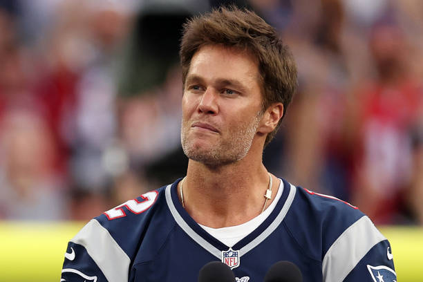 Former New England Patriots quarterback Tom Brady speaks during a ceremony honoring him at halftime of New England's game against the Philadelphia...