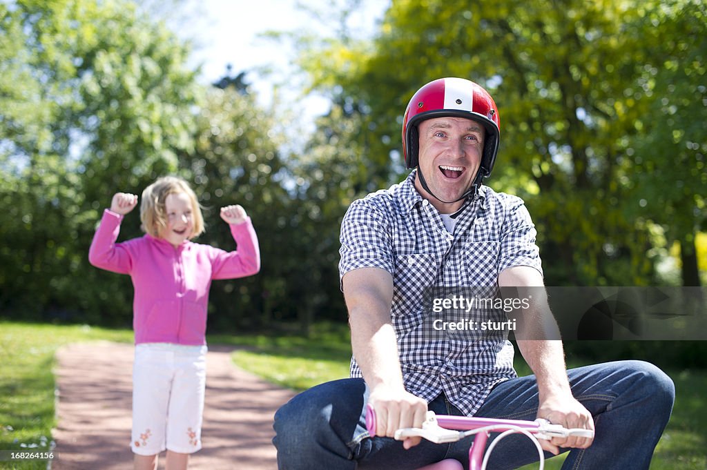 Dad learns to ride a bike