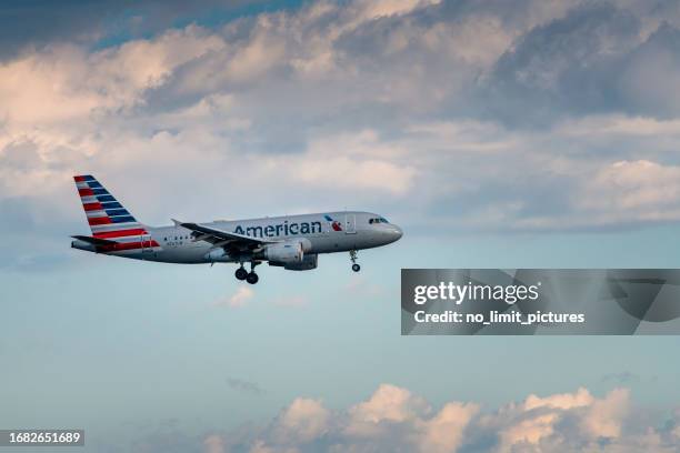 american airlines airplane flying over toronto in canada - american airlines bildbanksfoton och bilder