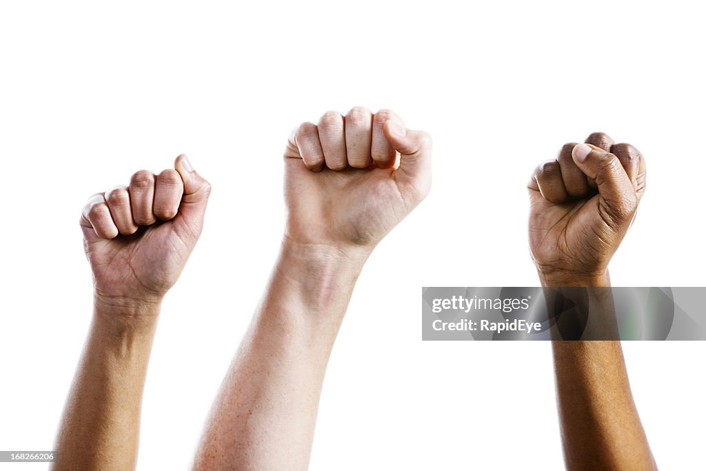 Three clenched fists air punch in triumph or defiance