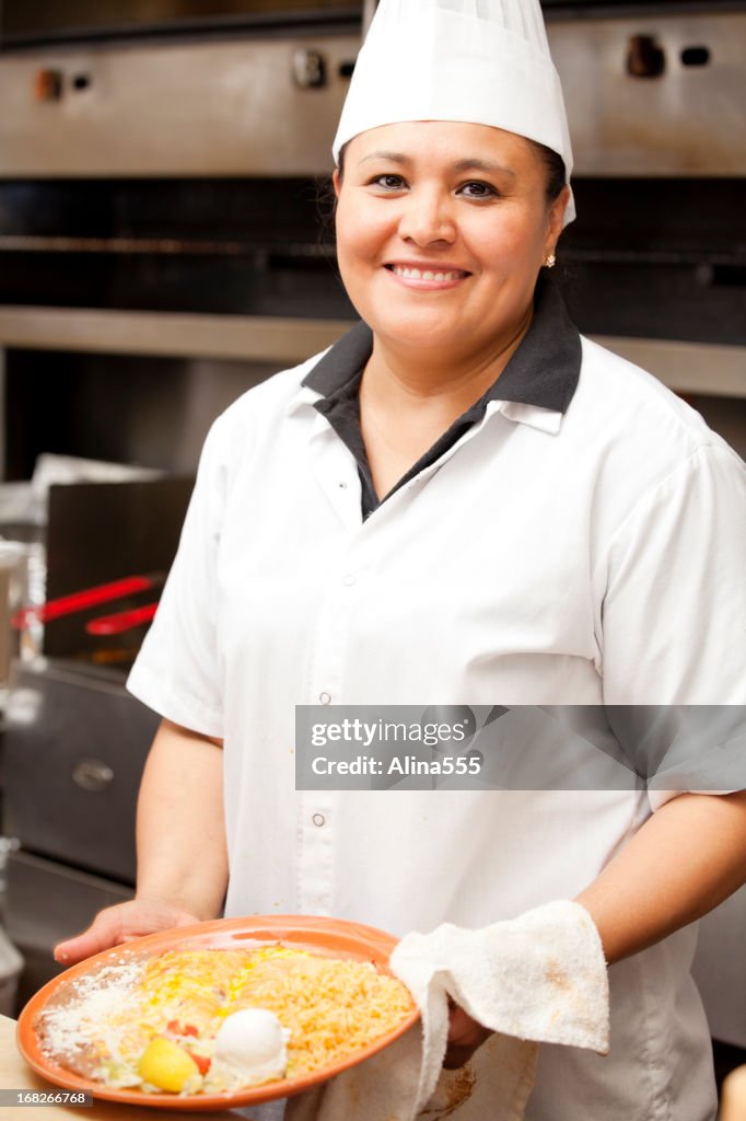 Portrait of happy smiling cook in mexican restaurant