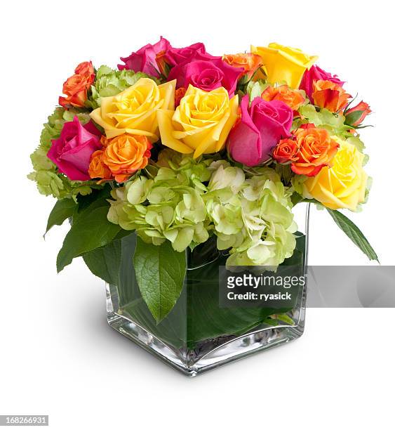 vibrant floral arrangement in square crystal vase isolated - flower arrangement stock pictures, royalty-free photos & images