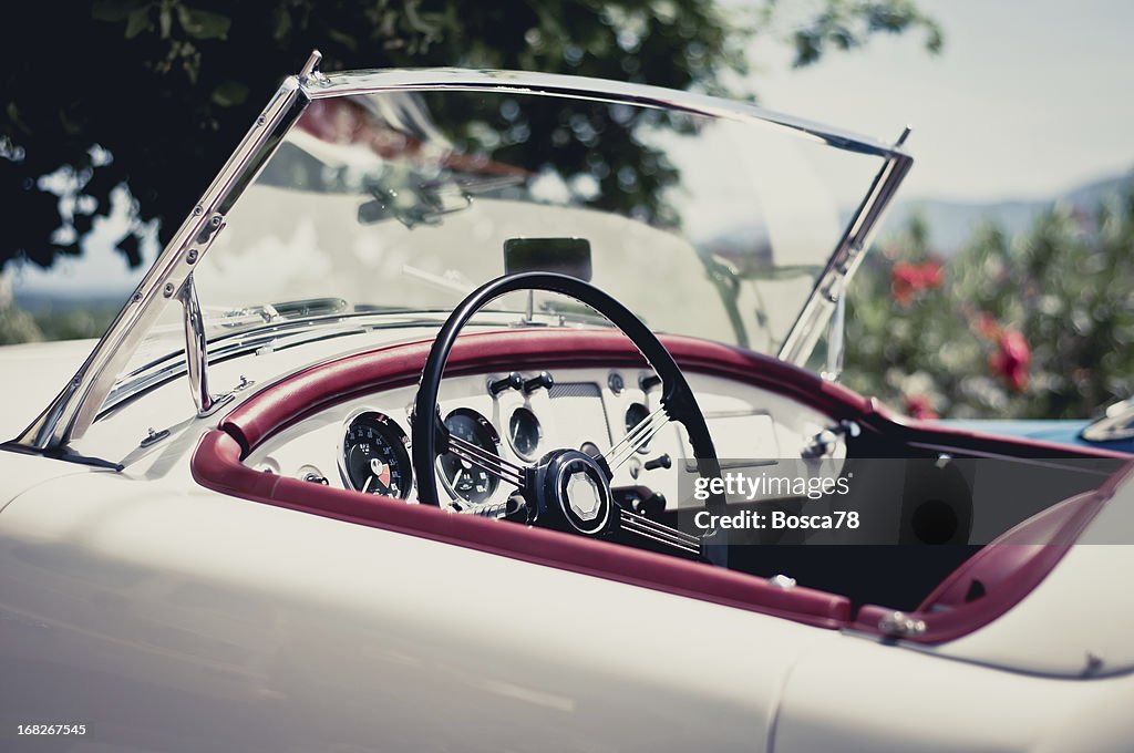 White convertible with red accents on a sunny day