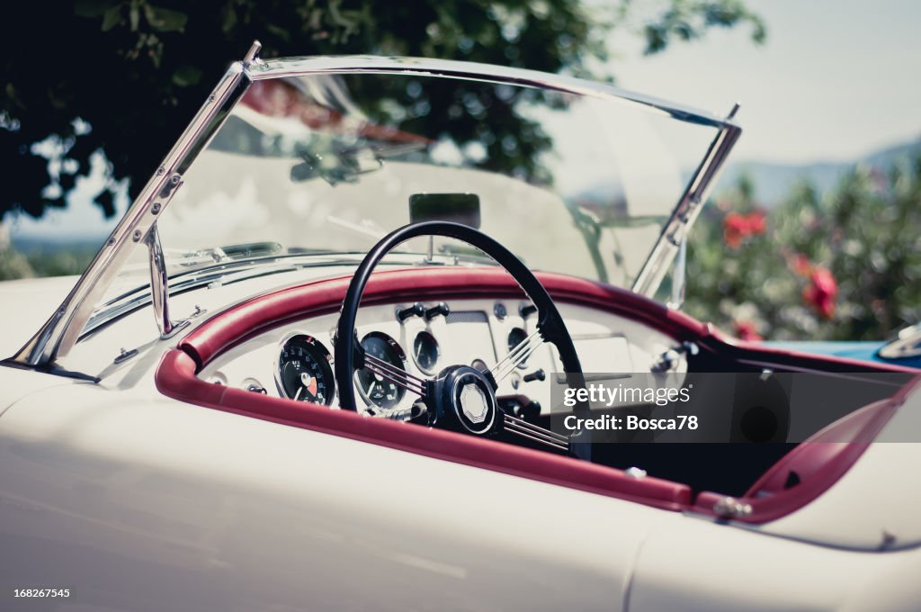 White convertible with red accents on a sunny day