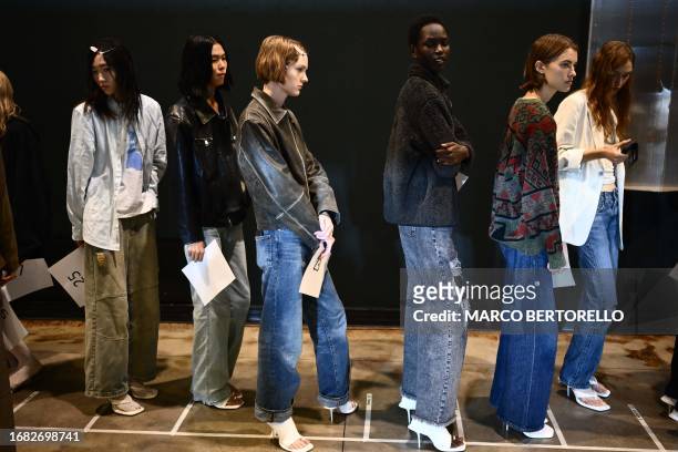 Models wait in line to get dressed backstage before Sportmax fashion show during the Milan Fashion Week Womenswear Spring/Summer 2024 on September...