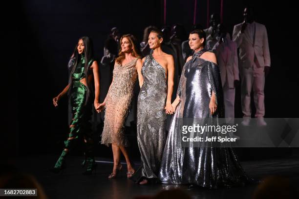 Naomi Campbell, Cindy Crawford, Christy Turlington and Linda Evangelista stand onstage during Vogue World: London at Theatre Royal Drury Lane on...