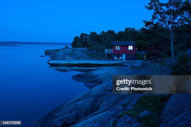 red cottage in the archipelago just after sunset - cabin stock pictures, royalty-free photos & images