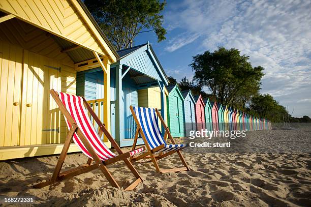deckchair beach scene - british culture stock pictures, royalty-free photos & images