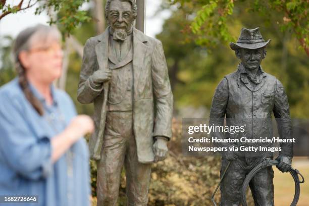 Sculptor Lynn Peverill talks about the new addition of The Rancher, shown right, to the Pioneers of Montgomery Monument in Cedar Brake Park...