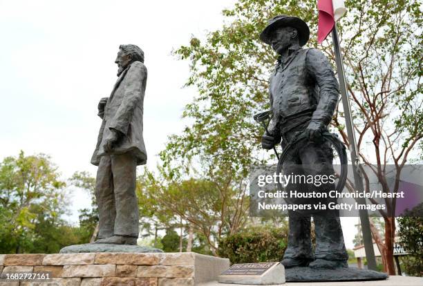 Statues of Charles B. Stewart, left, and The Rancher, right, are shown in Cedar Brake Park Wednesday, Sept. 13 in Montgomery. Sculptor Lynn Peverill...