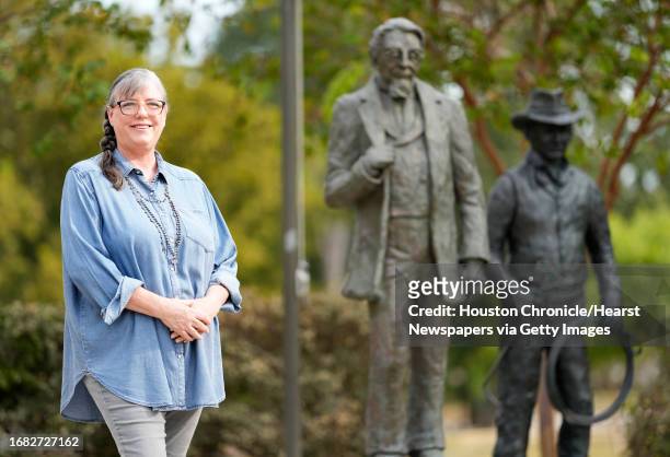 Sculptor Lynn Peverill talks about the new addition of The Rancher, shown right, to the Pioneers of Montgomery Monument in Cedar Brake Park...