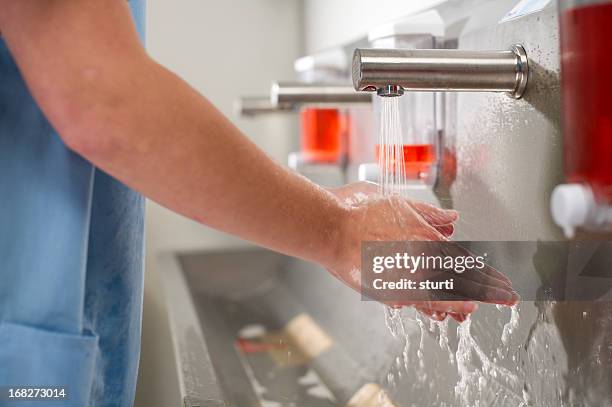 scrub up - nurse washing hands stock pictures, royalty-free photos & images