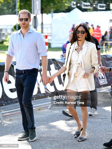 Prince Harry, Duke of Sussex and Meghan, Duchess of Sussex attend the cycling medal ceremony at the Cycling Track during day six of the Invictus...