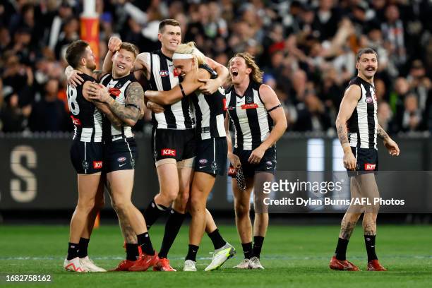 Collingwood players celebrate after the final siren during the 2023 AFL First Preliminary Final match between the Collingwood Magpies and the GWS...