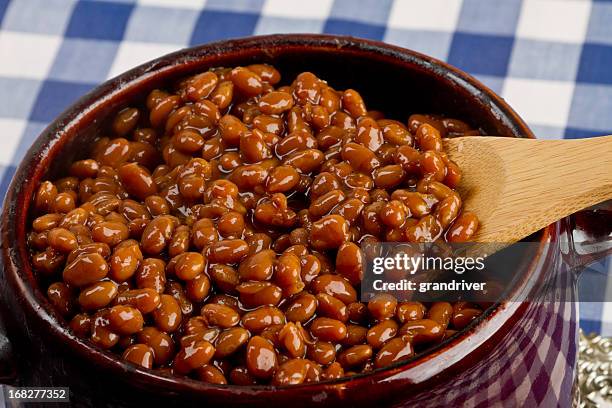 pot of baked beans on a blue gingham - baked beans stock pictures, royalty-free photos & images