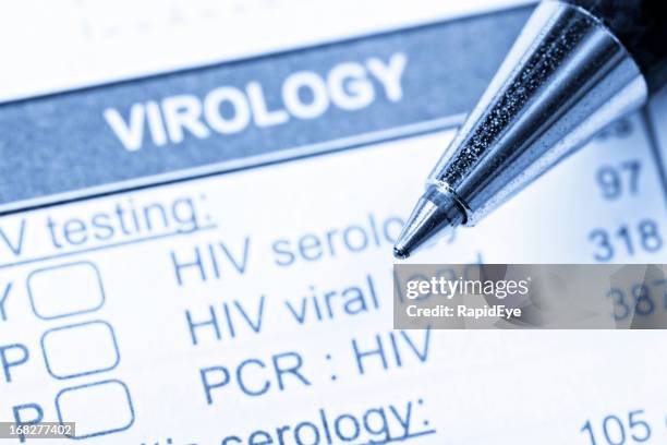 close up of pen on virology form  ordering hiv/aids tests - hiv test 個照片及圖片檔