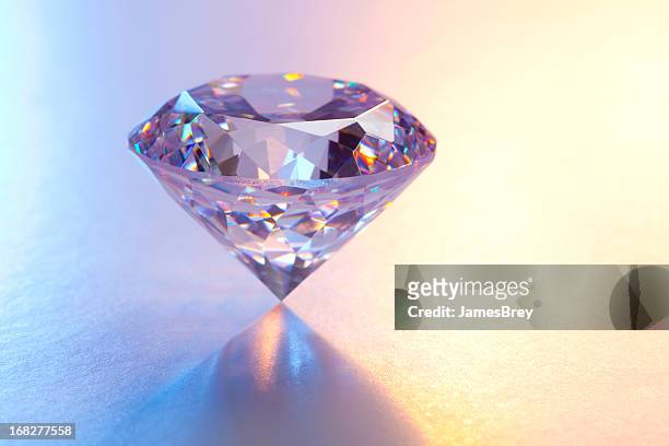 large diamond on reflective surface - diamond gemstone stock pictures, royalty-free photos & images