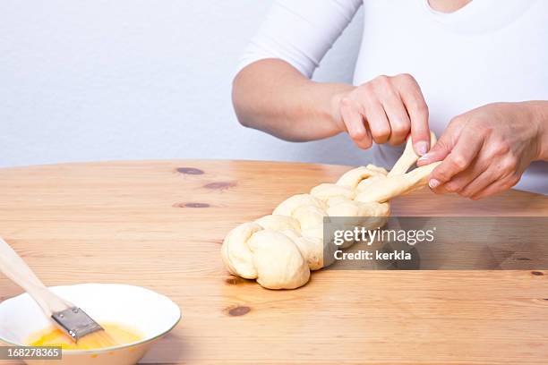 braiding dough plait - braided bread stock pictures, royalty-free photos & images