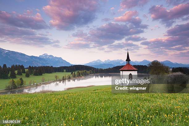 idyllic small chapel above a lake near f&#252;ssen, bavaria, germany - small chapel stock pictures, royalty-free photos & images