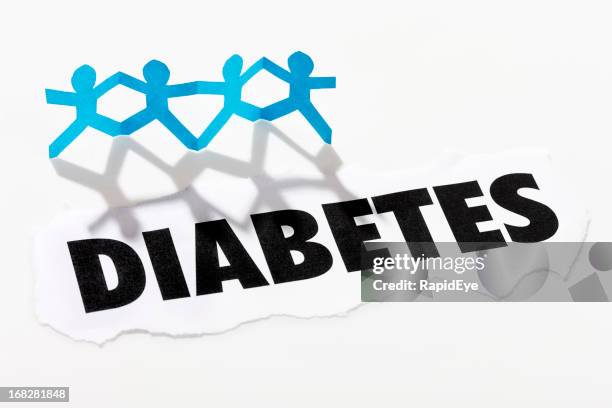 headline &quot;diabetes&quot;  below four paper-chain cut-out people - origami alphabet stock pictures, royalty-free photos & images