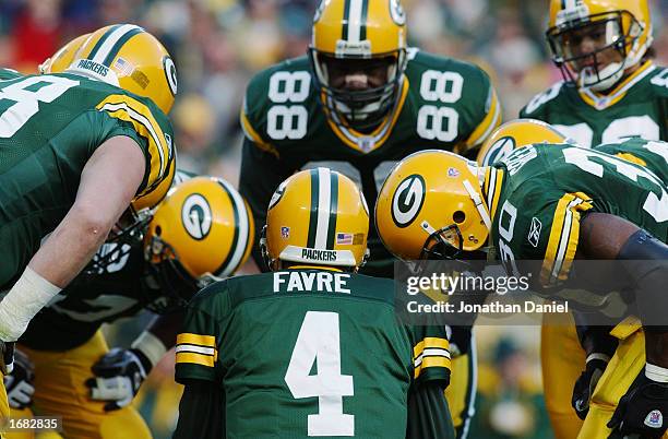 Quarterback Brett Favre of the Green Bay Packers huddled with his team during the NFL game against the Washington Redskins at Lambeau Field on...